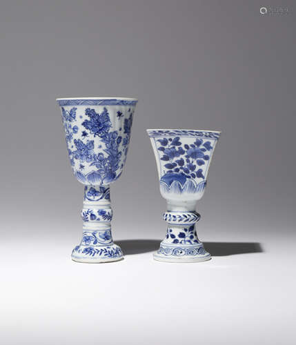 TWO CHINESE BLUE AND WHITE STEM CUPS KANGXI 1662-1722 One moulded with a ribbed body rising to a