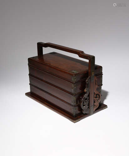 A CHINESE HARDWOOD THREE-TIERED PICNIC BOX AND COVER LATE QING DYNASTY The rectangular box with