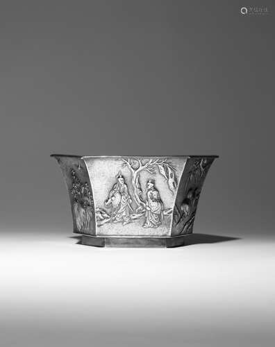 A CHINESE SILVER JARDINIERE 19TH CENTURY The flaring body with six facets, decorated in relief