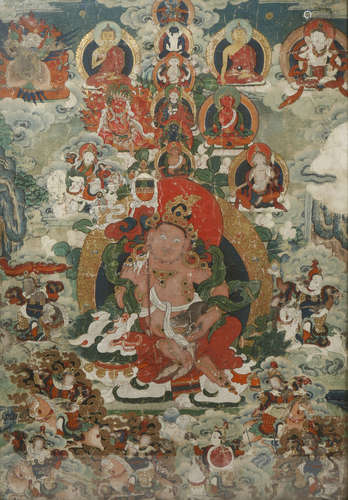 A TIBETAN THANGKA 19TH CENTURY Painted to the centre with Vaishravana seated upon a recumbent snow