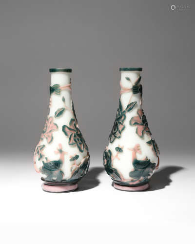 A PAIR OF CHINESE BEIJING PINK AND GREEN-OVERLAY GLASS 'PHOENIX' BOTTLE VASES 19TH CENTURY Each