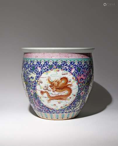 A LARGE CHINESE FAMILLE ROSE BLUE-GROUND 'DRAGON AND PHOENIX' JARDINIERE 20TH CENTURY Painted with