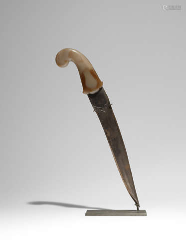 A MUGHAL DAGGER WITH A JADE HILT 19TH CENTURY The blade set in a jade hilt carved with a foliate