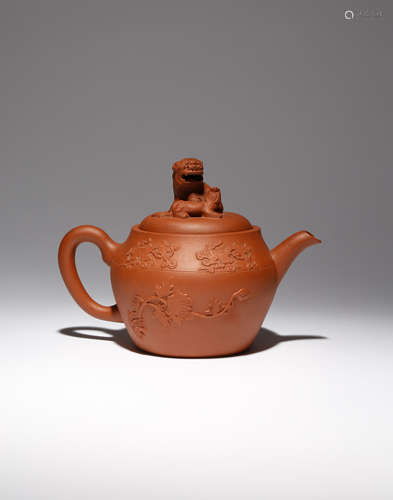 A LARGE CHINESE YIXING 'LION DOGS' TEAPOT AND COVER 18TH CENTURY The body tapering towards the rim