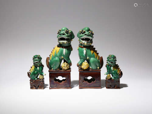 TWO PAIRS OF CHINESE SANCAI MODELS OF LION DOGS 19TH CENTURY Each beast depicted seated upon a