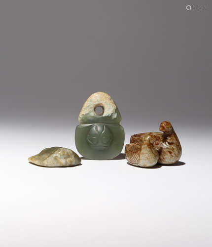 THREE CHINESE JADE CARVINGS QING DYNASTY OR LATER One carved in russet jade with two ducks facing