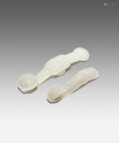 TWO CHINESE WHITE JADE RUYI SCEPTRE-SHAPED BELTHOOKS QING DYNASTY The larger belthook carved with