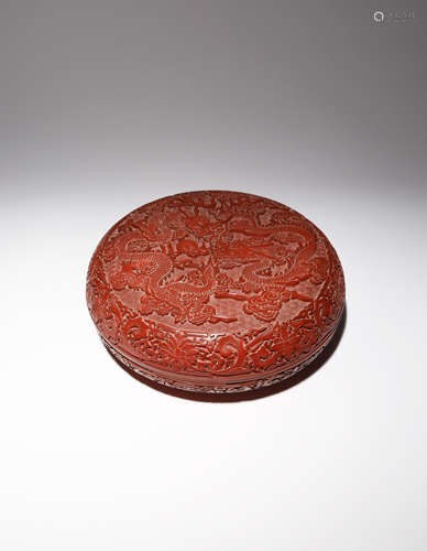 A LARGE CHINESE CINNABAR LACQUER CIRCULAR 'DRAGON' BOX AND COVER 20TH CENTURY The cover carved