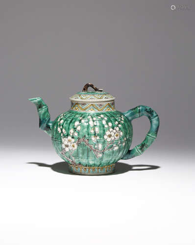 A CHINESE FAMILLE VERTE MOULDED 'PRUNUS' TEAPOT AND COVER KANGXI 1662-1722 Decorated with two