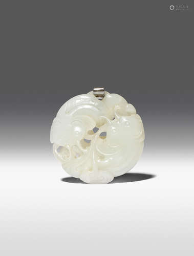 A CHINESE PALE CELADON JADE CIRCULAR 'CATFISH' PENDANT 18TH CENTURY Carved in openwork as two