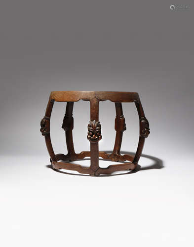 A SOUTHEAST ASIAN HARDWOOD STAND 19TH/20TH CENTURY With five curved legs joined by stretchers,