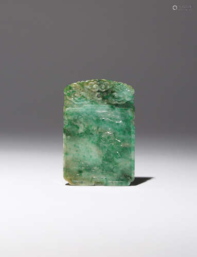 A CHINESE APPLE GREEN JADEITE PENDANT QING DYNASTY The rectangular pendant carved in low relief to