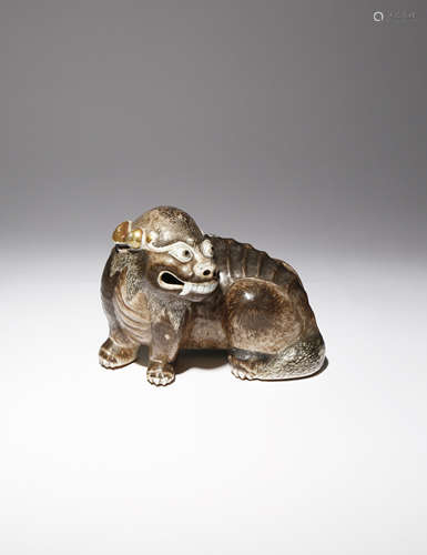 A RARE CHINESE ENAMELLED PORCELAIN MODEL OF A LION DOG QIANLONG 1736-95 The mythical best depicted