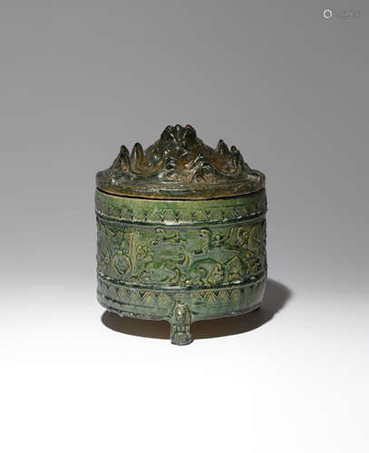 A CHINESE GREEN GLAZED POTTERY 'HILL' JAR AND COVER HAN DYNASTY The cylindrical body moulded in