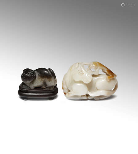 A CHINESE JADE 'HORSE AND MONKEY' BELT BUCKLE AND A JADE CARVING OF A CAT 19TH CENTURY The belt