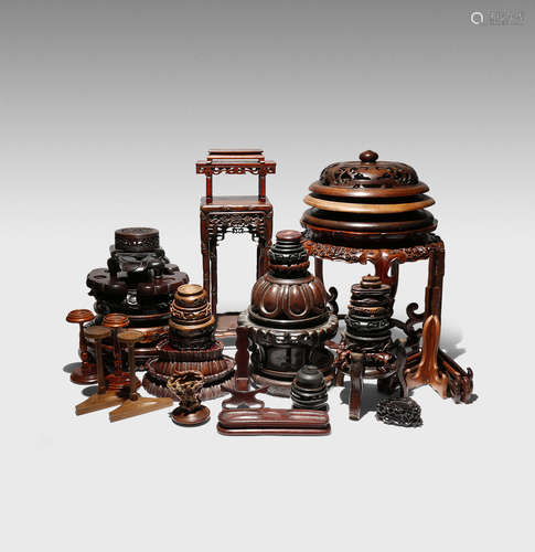 A COLLECTION OF CHINESE WOOD STANDS AND COVERS 19TH AND 20TH CENTURY Variously carved with