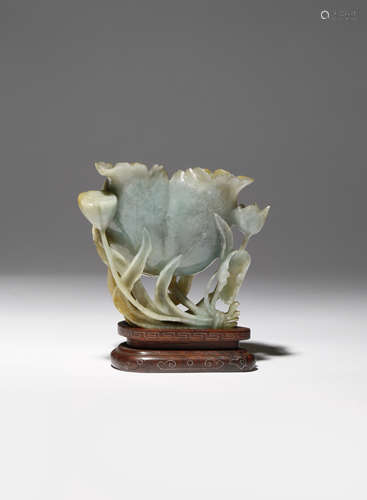 A CHINESE CELADON JADEITE 'LOTUS' WATERPOT LATE QING DYNASTY Carved as a large lotus with its petals