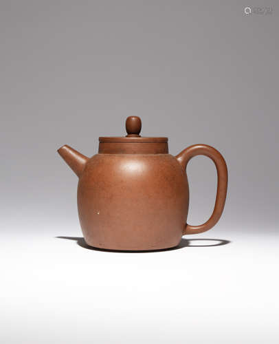 A LARGE CHINESE YIXING TEAPOT AND COVER LATE 18TH/EARLY 19TH CENTURY The plain body set with an