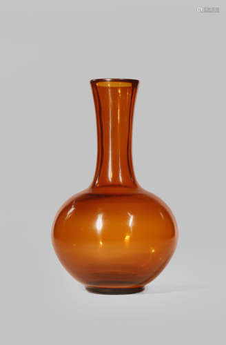 A CHINESE BEIJING AMBER GLASS BOTTLE VASE 19TH/20TH CENTURY The ovoid body surmounted by a tall