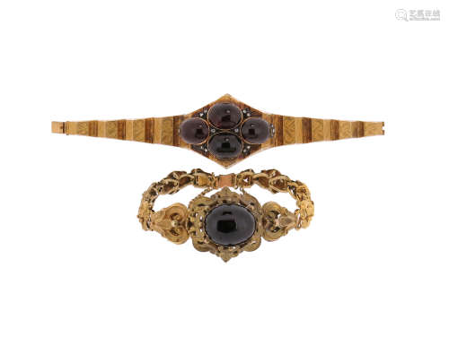 A Victorian garnet-set gold bracelet, set with four cabochon garnets decorated with rose-cut