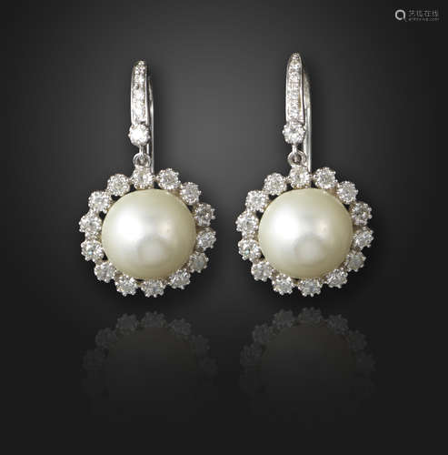 A pair of natural pearl and diamond drop earrings, the pearls set within a surround of old