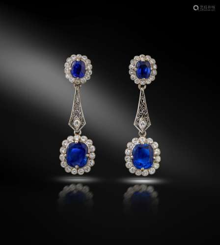 A pair of Edwardian sapphire and diamond drop earrings, the upper cluster sections set with