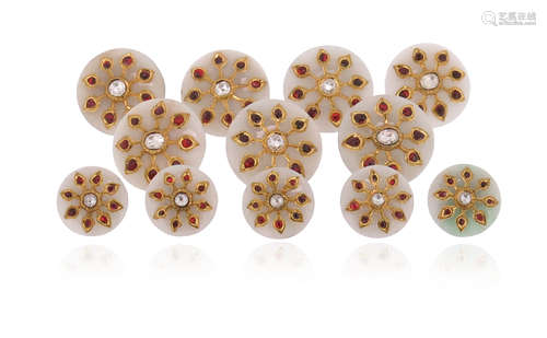 A set of twelve Indian gem-set jade buttons, each button applied with a gold foliate motif set