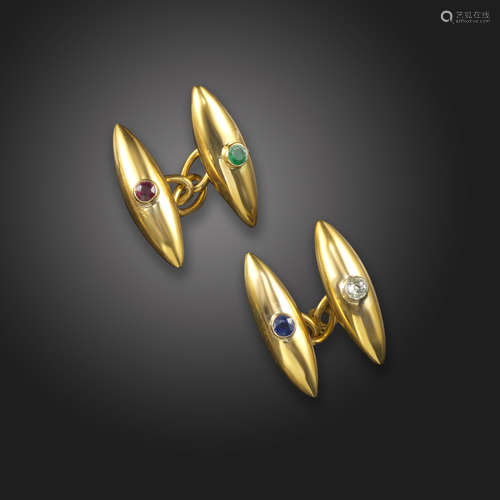 A pair of gem-set gold cufflinks, the gold torpedo links set with an old circular-cut diamond,