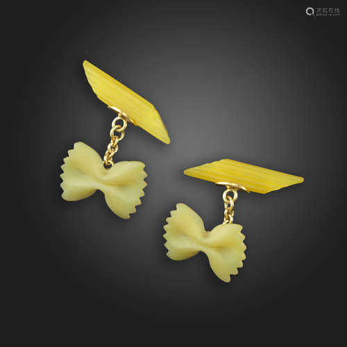 A pair of hardstone pasta cufflinks, designed as a piece of farfalle and penne pasta in carved