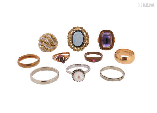 A collection of ten rings, including an amethyst-set gold ring, size M 1/2, a diamond-set two-colour