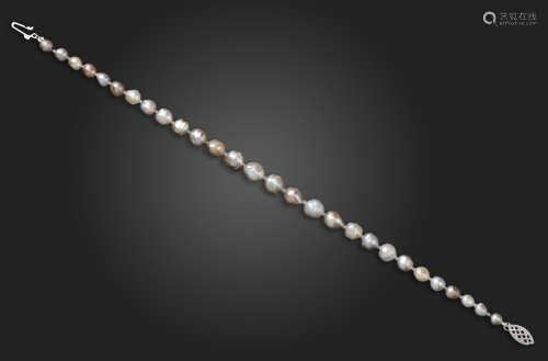 A natural pearl bracelet, the pearls graduate from 3.8 - 6.3mm, with a white gold clasp, 20cm long