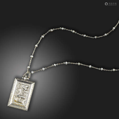 An Art Deco diamond-set travel clock pendant, the rectangular pendant case applied with a diamond-