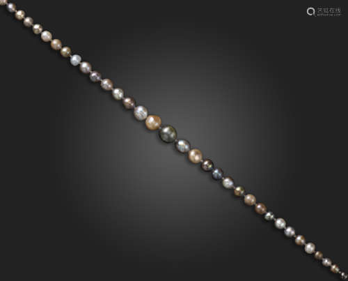 A single-row natural pearl necklace, the pearls graduate from 3.9 - 9.4mm, with a diamond and