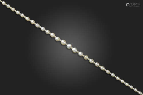 A single-row natural pearl necklace, the pearls graduate from 3.0 - 7.4mm mm, with seed pearl