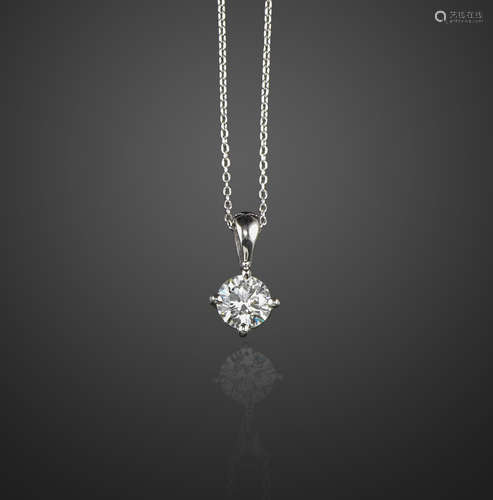 A diamond solitaire pendant, the round brilliant-cut diamond weighs 0.52cts, claw-set in platinum on