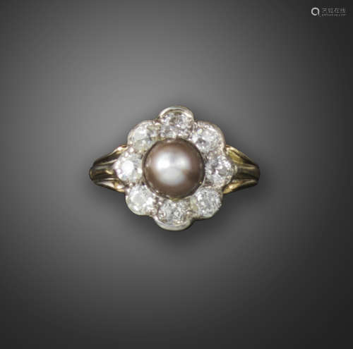 A natural pearl and diamond cluster ring, centred with a grey natural pearl within a surround of old