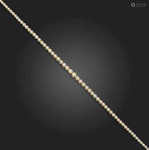 A single-row natural pearl necklace, the natural pearls graduate from 2.1 - 6.6mm, with a diamond-