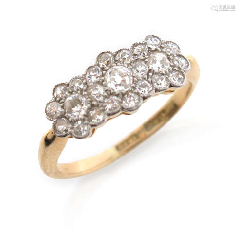 An Edwardian diamond triple cluster ring, millegrain-set with graduated old circular-cut diamonds in