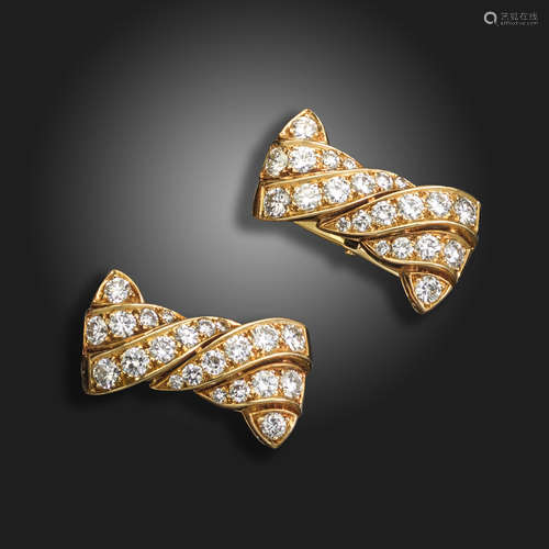 A pair of French diamond-set yellow gold stylised bow cufflinks, set with graduated round