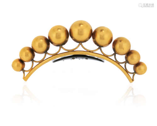λ A mid 19th century silver gilt hair ornament, the graduated spheres set on a tortoiseshell comb,