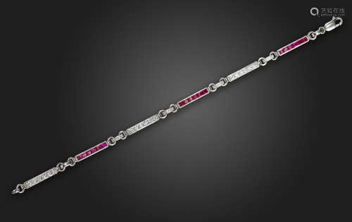 A ruby and diamond bracelet, the bar links set with French-cut rubies and round brilliant-cut