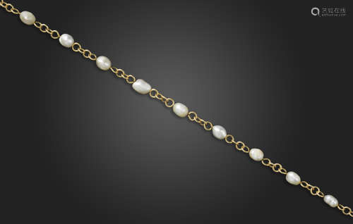 A natural pearl-set gold necklace, the natural pearls graduate from 6.7 - 10.1mm widest,