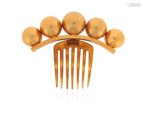 λ A mid 19th century silver gilt hair ornament, the five graduated spheres set on a tortoiseshell