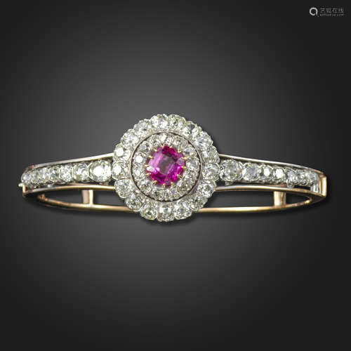 A late Victorian pink sapphire and diamond convertible bangle, the cushion-shaped pink sapphire