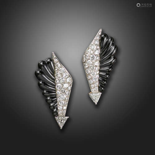 A pair of late Art Deco onyx and diamond arrow earrings, the carved black onyx adjacent to pave-