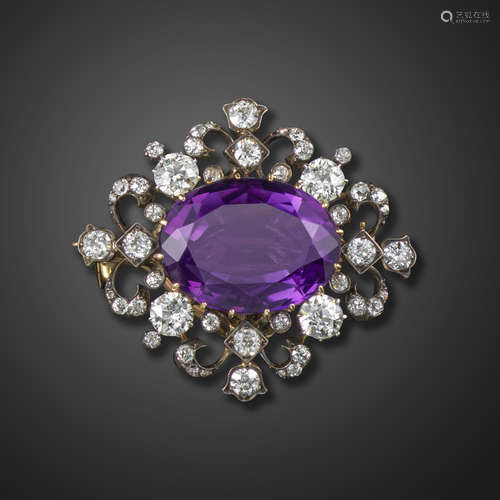 A Victorian amethyst and diamond-set brooch pendant, centred with an oval-shaped amethyst, with