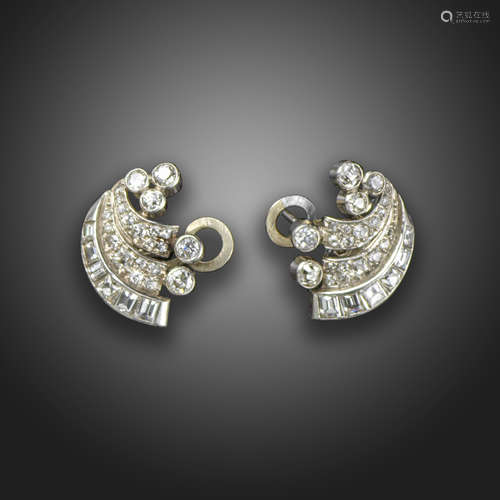 A pair of diamond-set scroll earrings, c.1940, set with baguette, square and circular-cut diamonds