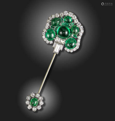 An emerald and diamond-set jabot pin, of stylised palmette form, set with six cabochon emeralds