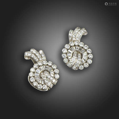 A pair of diamond scroll earrings, c.1940, set with graduated baguette-shaped and circular-cut