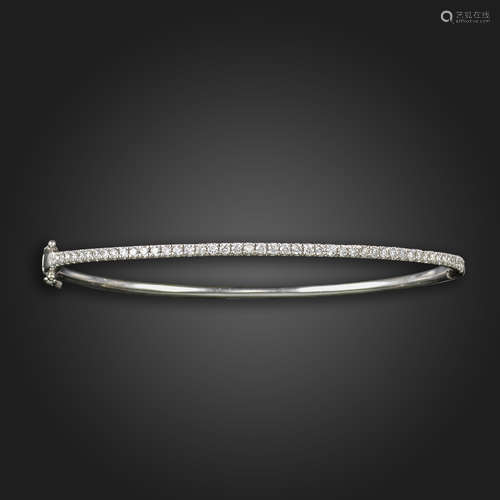 A diamond-set white gold bangle, half pavé-set with round brilliant-cut diamonds, diamonds 0.50cts